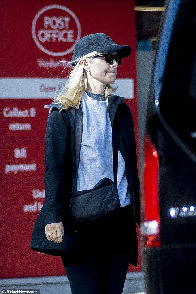 The former This Morning host added to her look with a light grey jumper and dark grey T-shirt