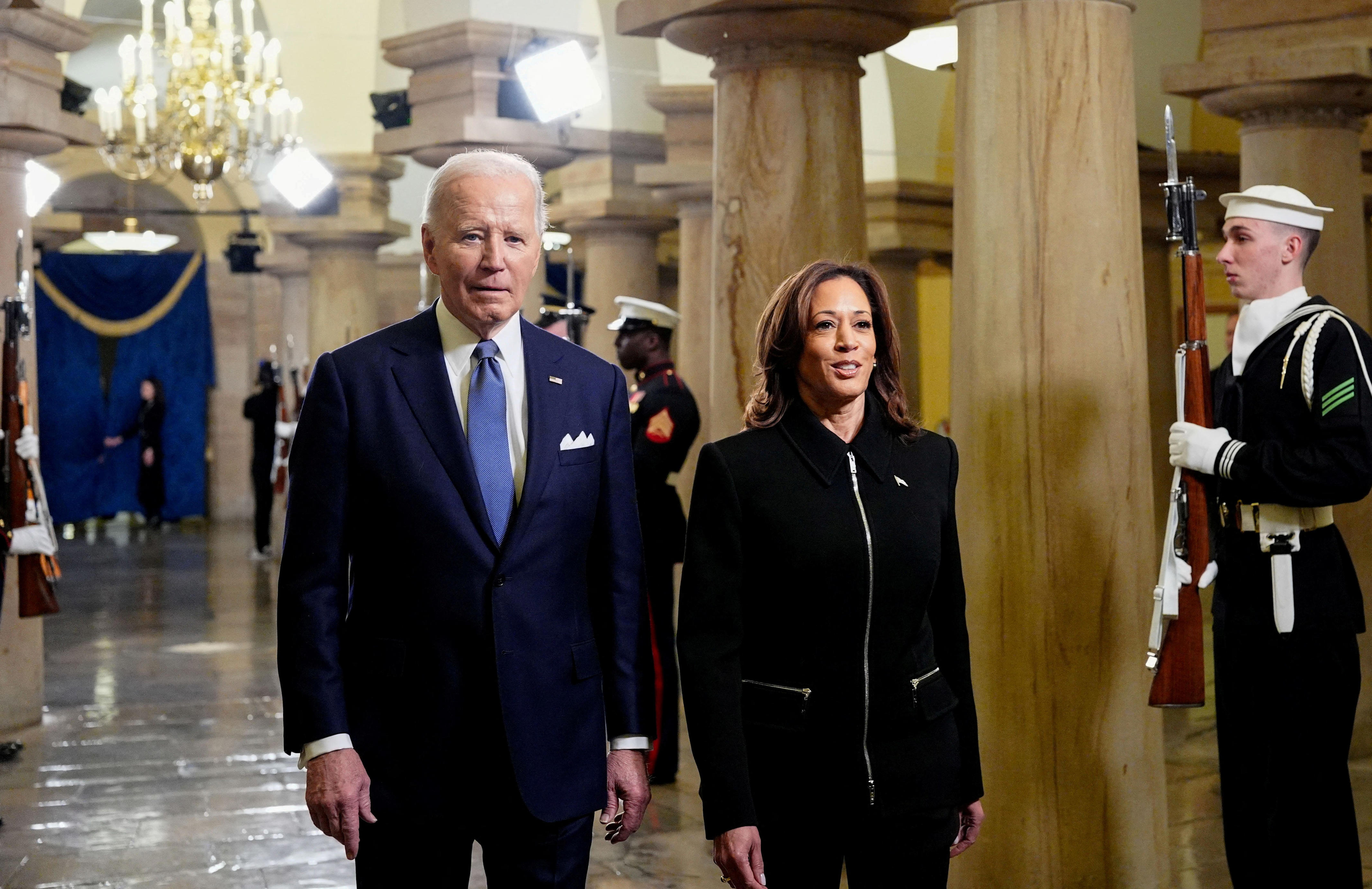 President Joe Biden and Vice President Kamala Harris arrive ahead of the 60th inaugural ceremony on January 20, 2025, at the US Capitol in Washington, DC. Trump becomes the 47th president of the United States in a rare indoor inauguration ceremony. The parade was also moved inside Capitol One Arena due to weather.