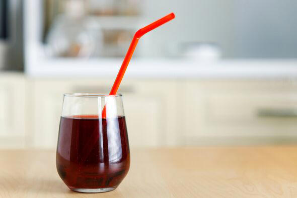 Delicious pomegranate juice in glass on table
