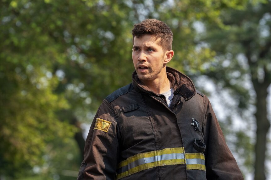 Sal Vasquez (Brandon Larracuente) wears a fireman jacket outside on Chicago Fire Episode 1401.