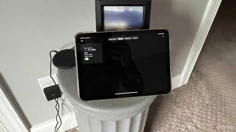An iPad with an alarm clock on it.