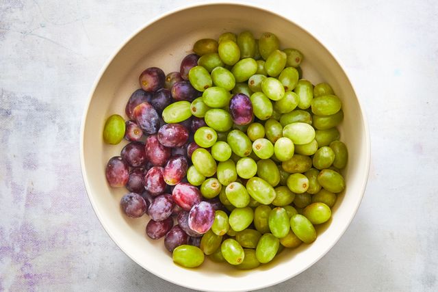 red and green grapes in a cream bowl