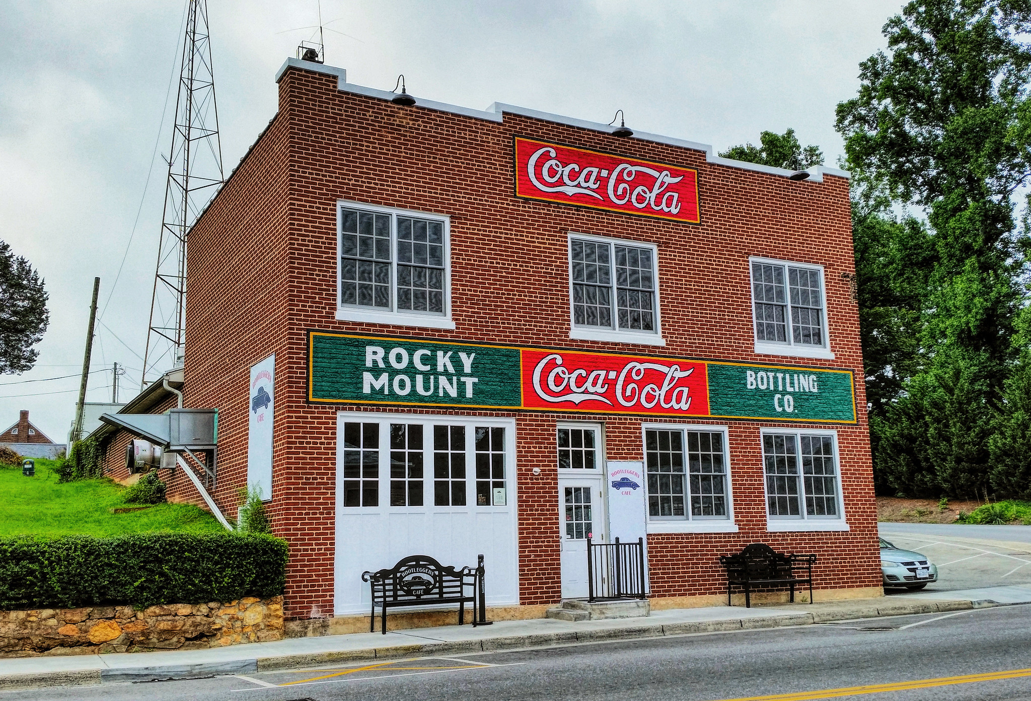 One of the Coca Cola bottling plants in Rocky Mount, VA. It's a brick building under a grey sky.