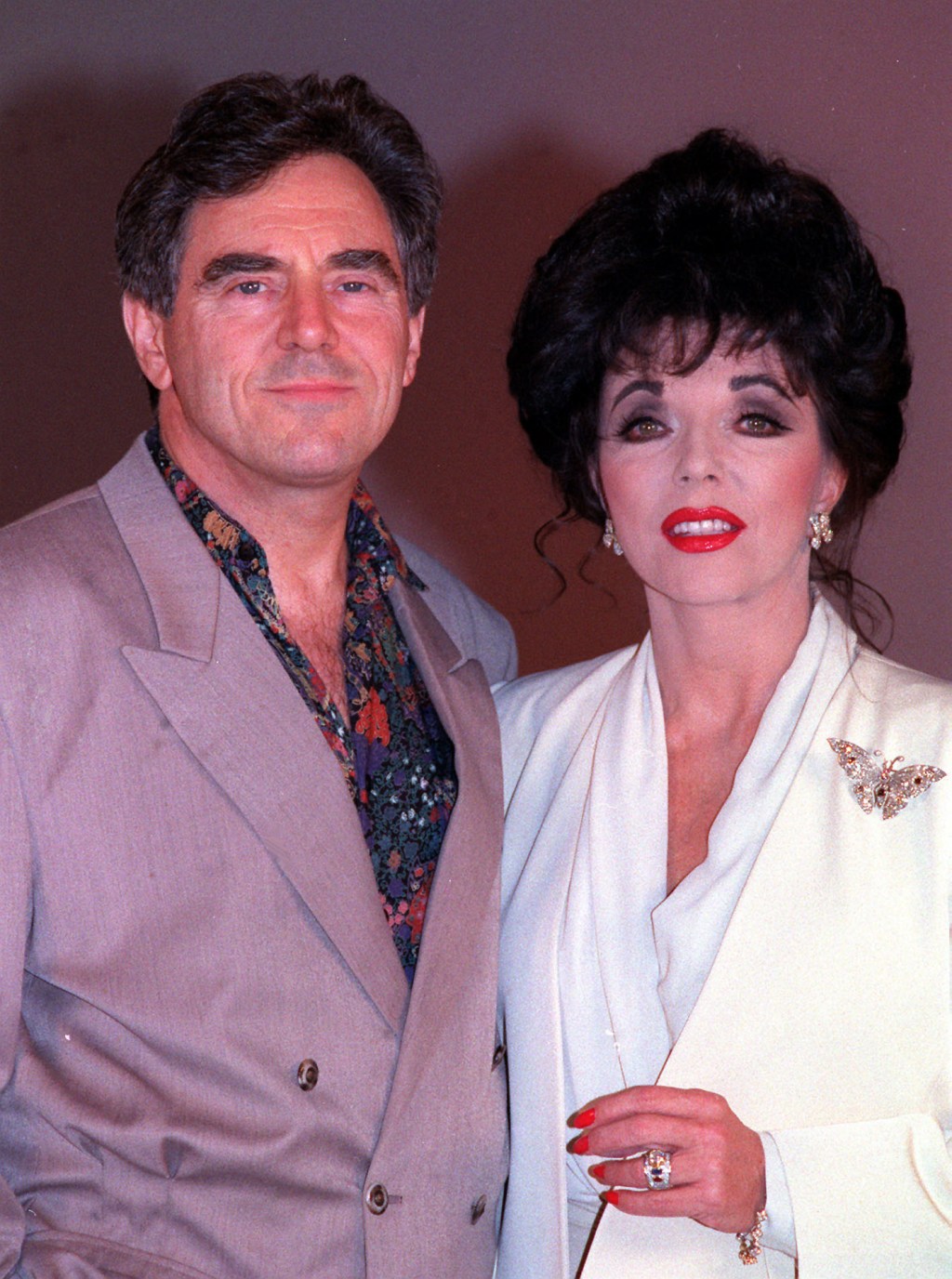 Joan Collins, 92, walks son Alexander Newley down the aisle at his