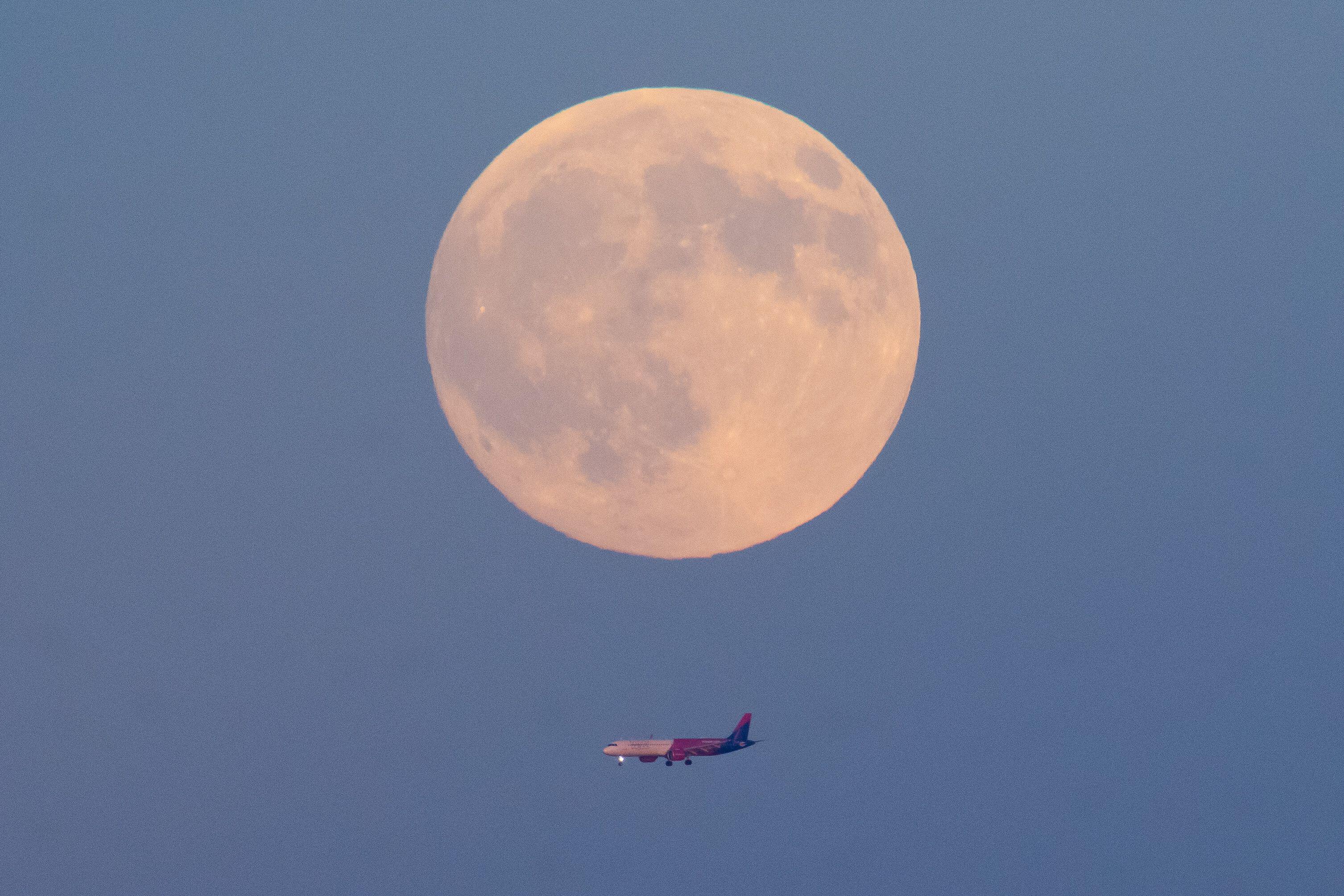 In pictures: Rare 'harvest' October supermoon lights up the night skies