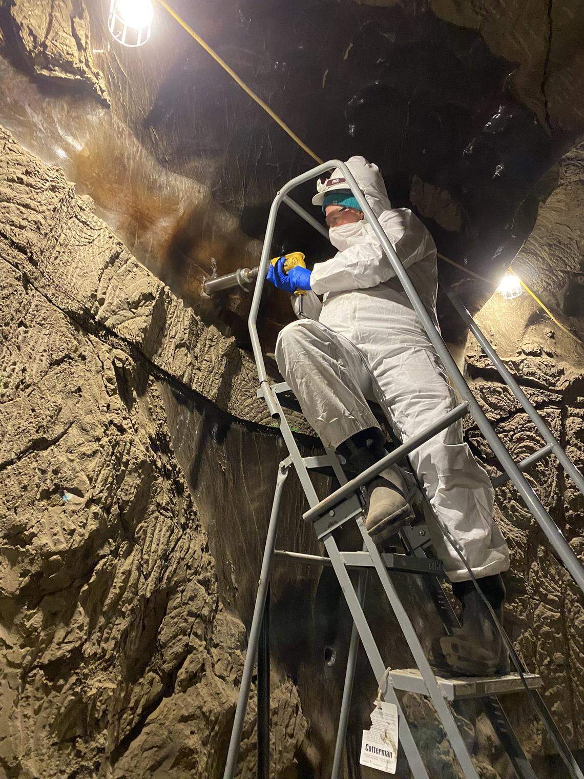 Robyn Barbato of the Cold Regions Research and Engineering Laboratory drills into subsurface ice.
