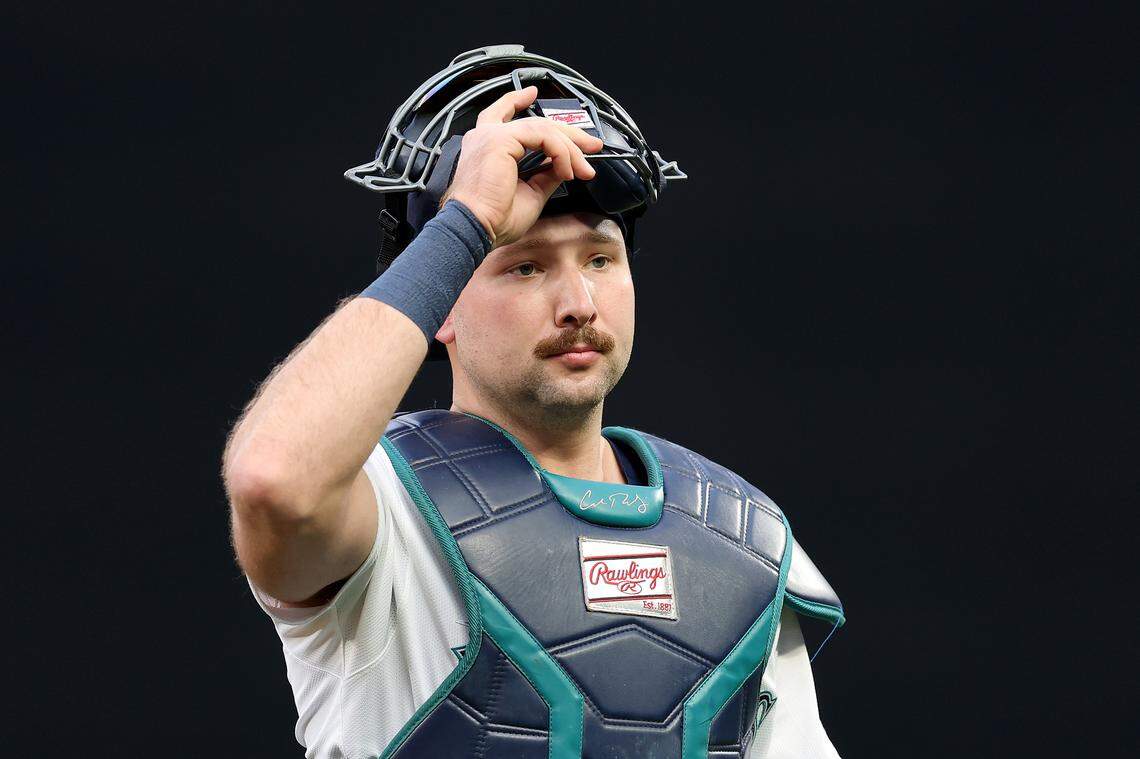 MLB star Cal Raleigh wears a special catcher's mitt. It has a Clemson