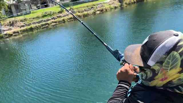 Sewer fishing on a Toy rod