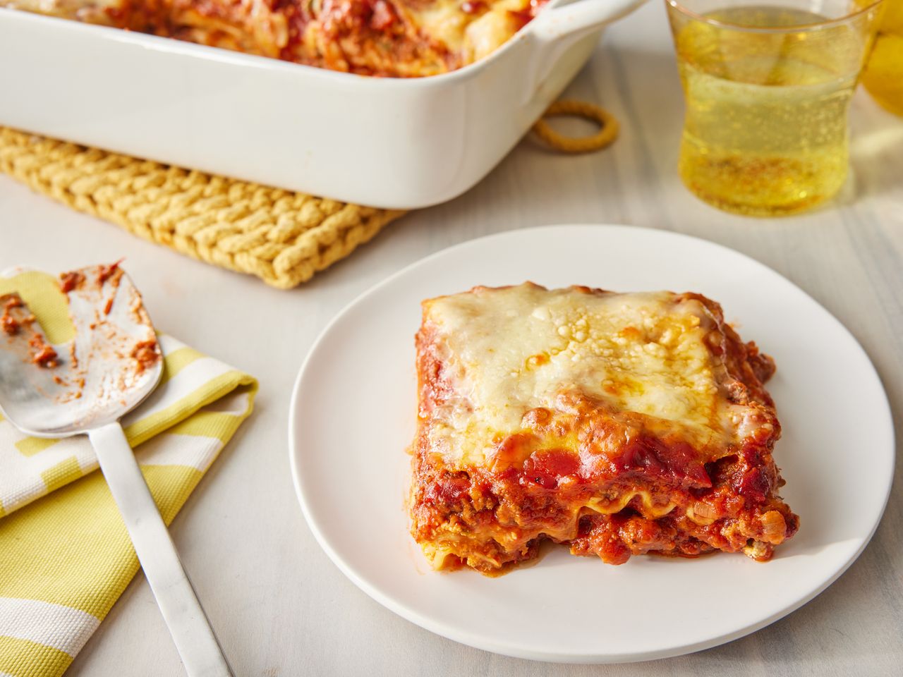a close up view on a plated slice of world famous lasagna.