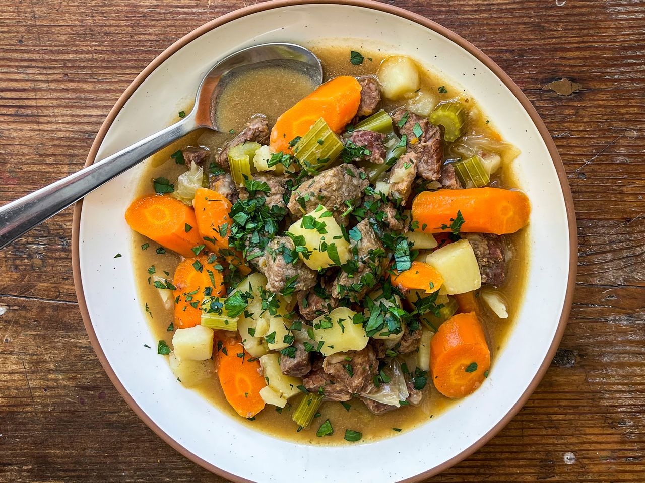 a top down view on a bowl of classic beef stew.