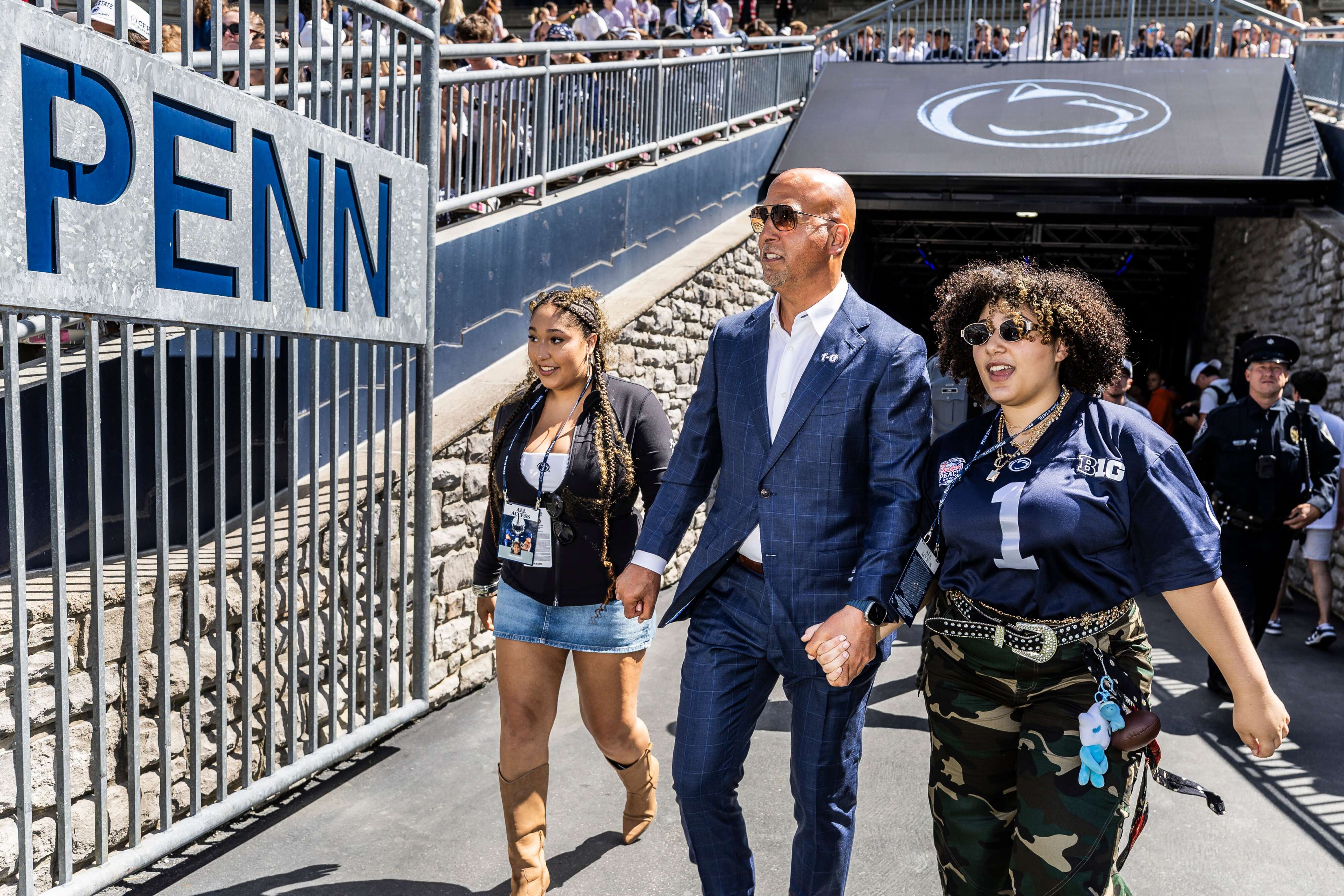 Penn State head coach James Franklin and his daughters, Shola and Addy make their way into Beaver Stadium for the home opener against Nevada. Aug. 30, 2025. Joe Hermitt | jhermitt@pennlive.com Joe Hermitt | jhermitt@pennlive.com