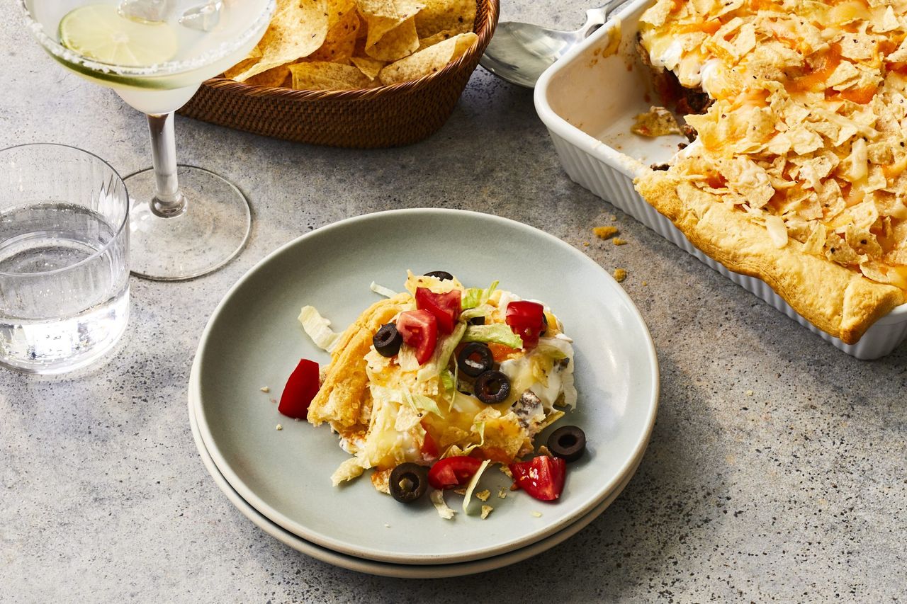 Overhead shot of taco pie on a plate with taco pie casserole next to it