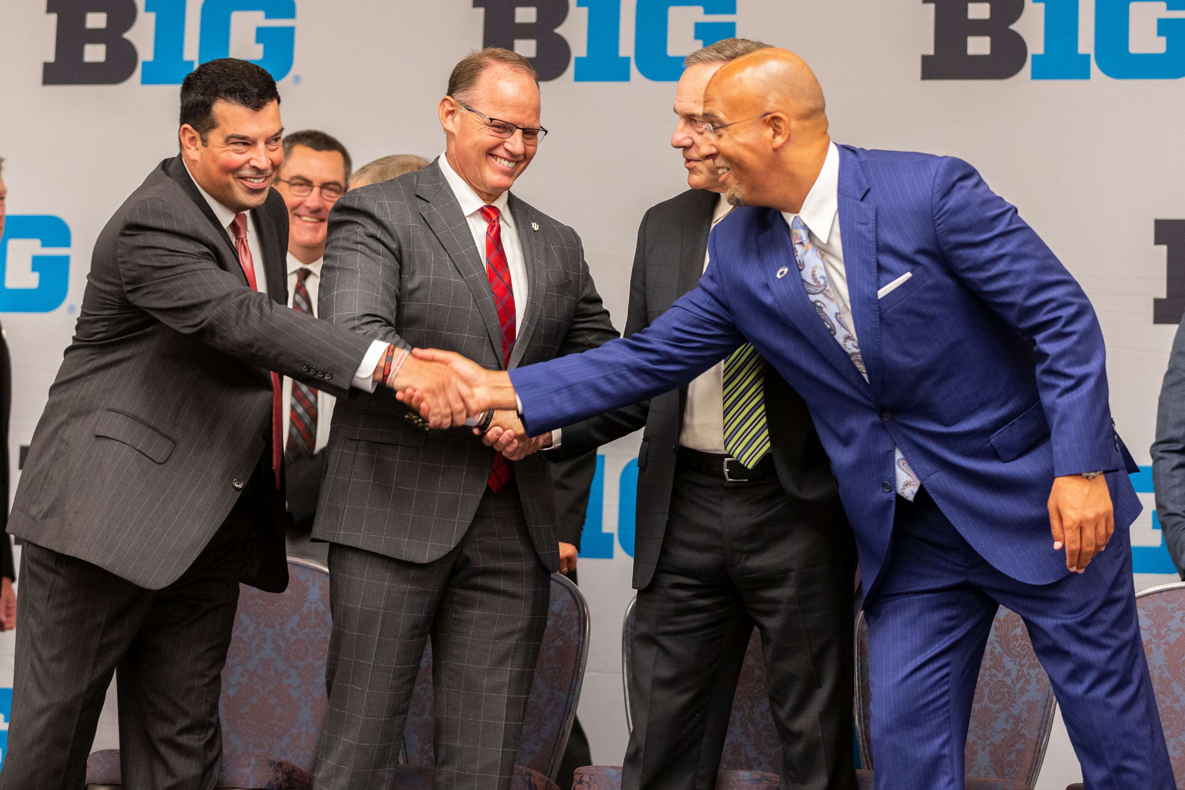 Ohio State coach Ryan Day greets Penn State head coach James Franklin with Indiana coach Tom Allen looking on before the group photo at the Big Ten football Media Days in Chicago, Il. on July 19, 2019. Joe Hermitt | jhermitt@pennlive.com