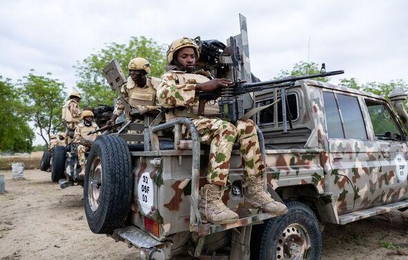 A Nigerian soldier from the Multinational Joint Task Force (MNJTF) loads his machine gun during training at the MNJTF military base, Sector 3 Headquar