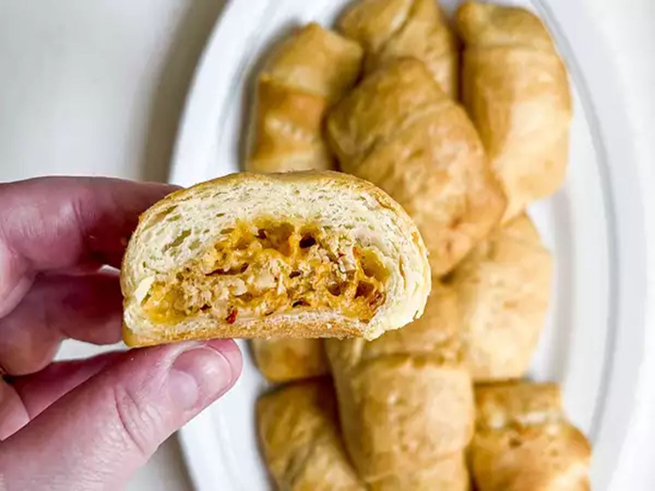 salmon crescent rolls on a white plate
