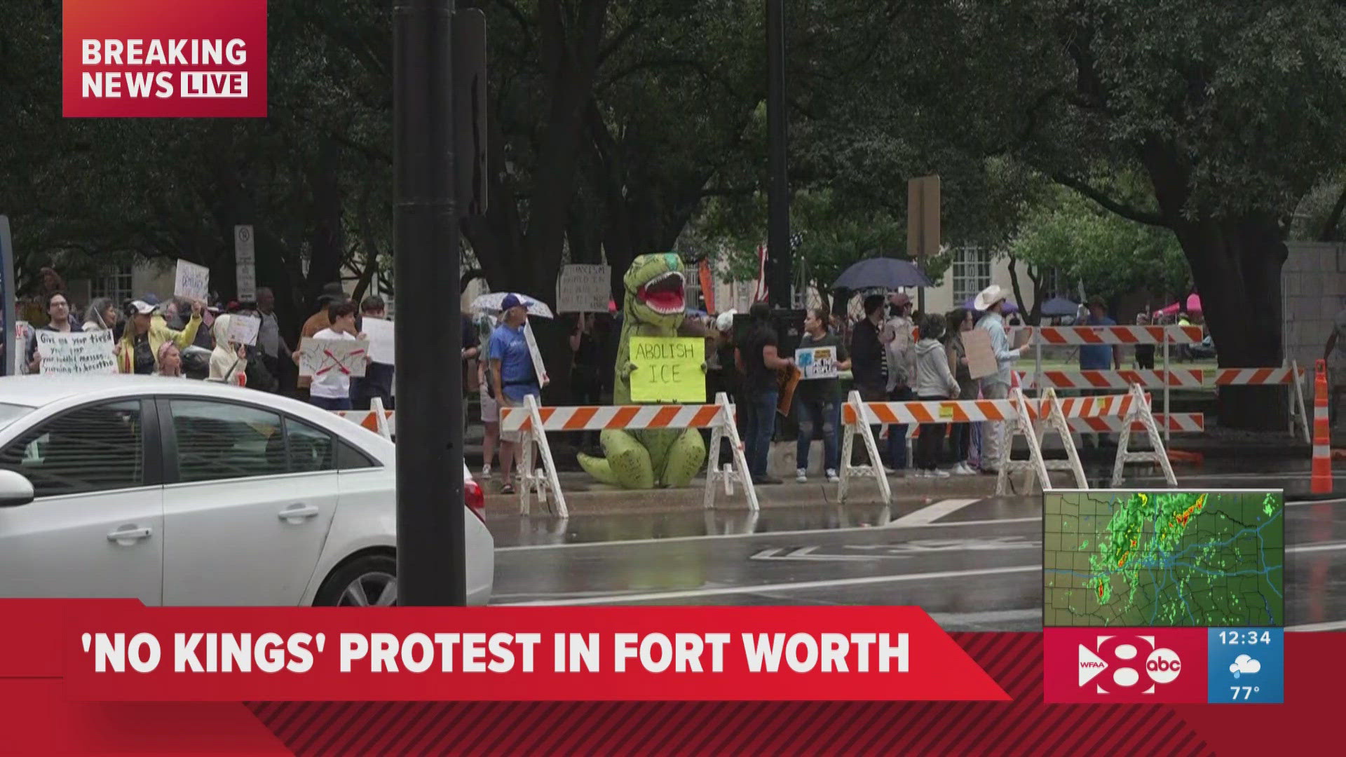 No Kings Protest | Texas protester in inflatable dinosaur costume holds ...
