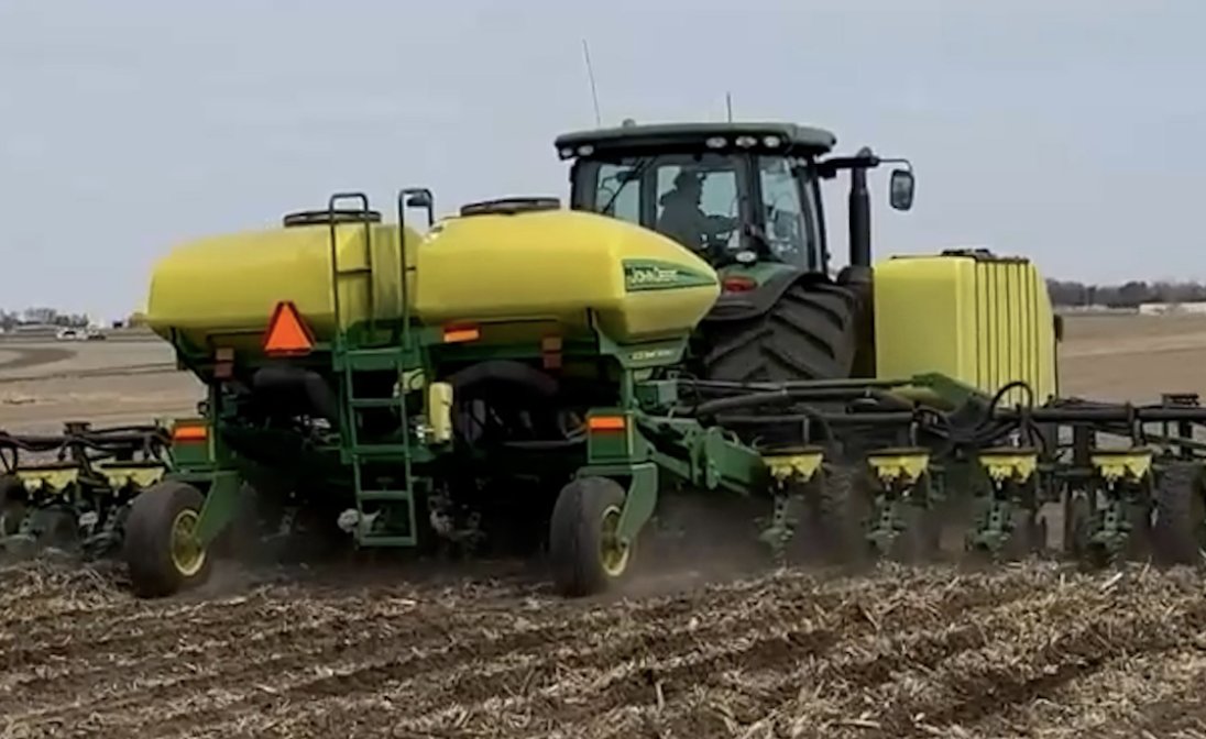 Young Farmers Planting Corn