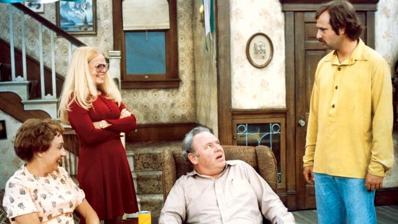 The Bunker family including Archie, Edith, Gloria, and Mike in living room in All in the Family