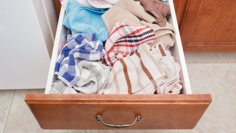 This Easy Kitchen Towel Folding Trick Frees Up Space In Shallow Drawers