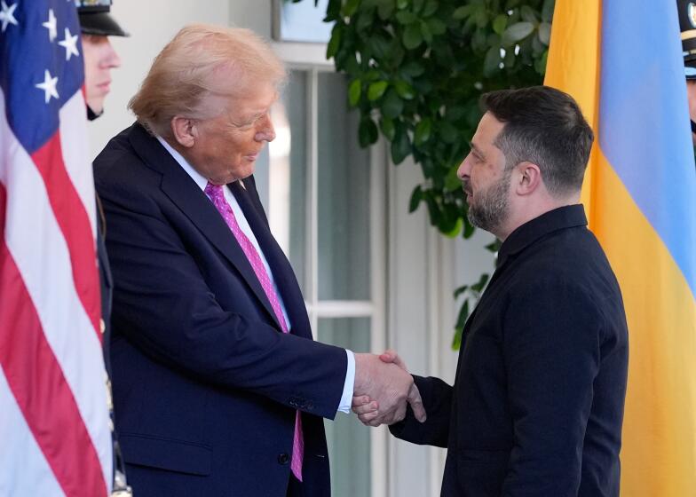 President Donald Trump, left, greets Ukraine's President Volodymyr Zelenskyy at the White House, Friday, Oct. 17, 2025, in Washington. (AP Photo/Alex Brandon)