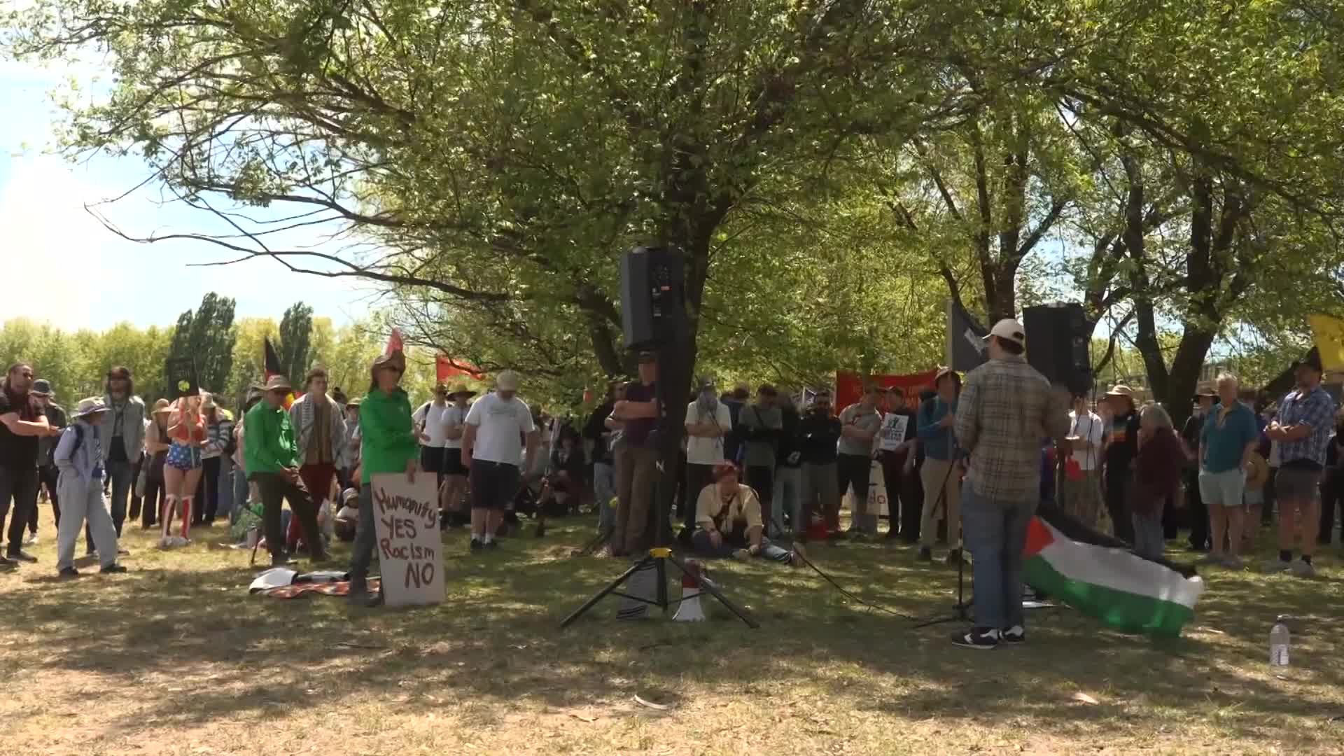 Anti-migration protestors and counter demonstrators clash in Canberra ...