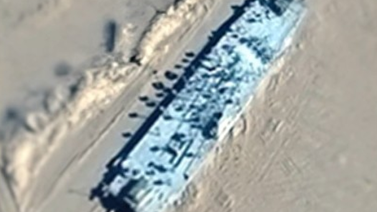 China Has a Fake US Aircraft Carrier on Railroad Tracks in the Desert