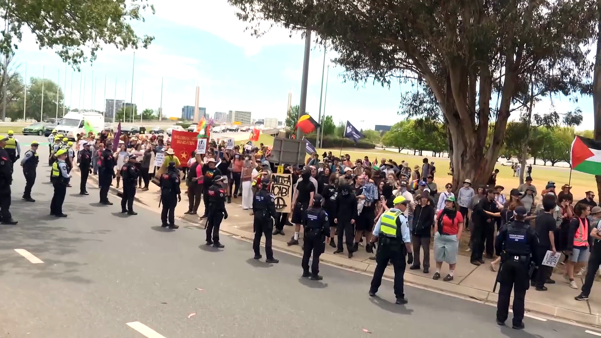 Anti-migration protestors and counter demonstrators clash in Canberra ...