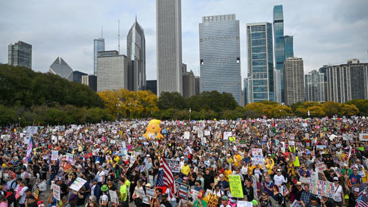 Demonstrators protest during the "No Kings" march at Grant Park on Saturday in Chicago. - Joshua Lott/The Washington Post/Getty Images