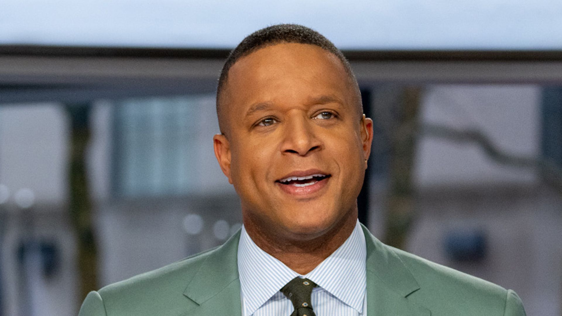 Craig Melvin on Today wearing a suit and looking confused