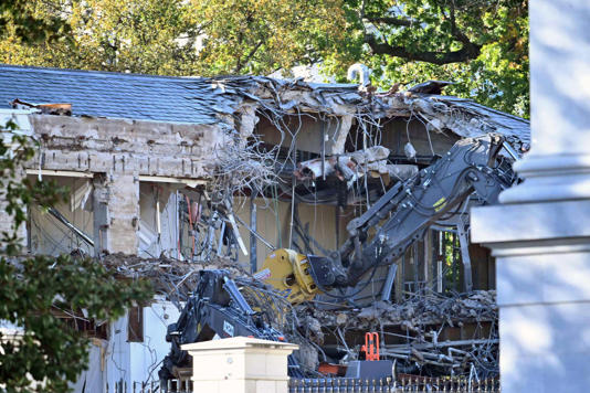 Heavy machinery tears down a section of the East Wing of the White House as construction begins on President Donald Trump's planned ballroom, in Washington, DC, on October 20, 2025.  / Credit: PEDRO UGARTE/AFP via Getty Images