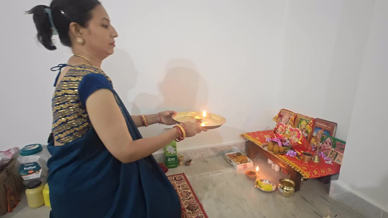 Indian families celebrate Diwali with religious displays at home