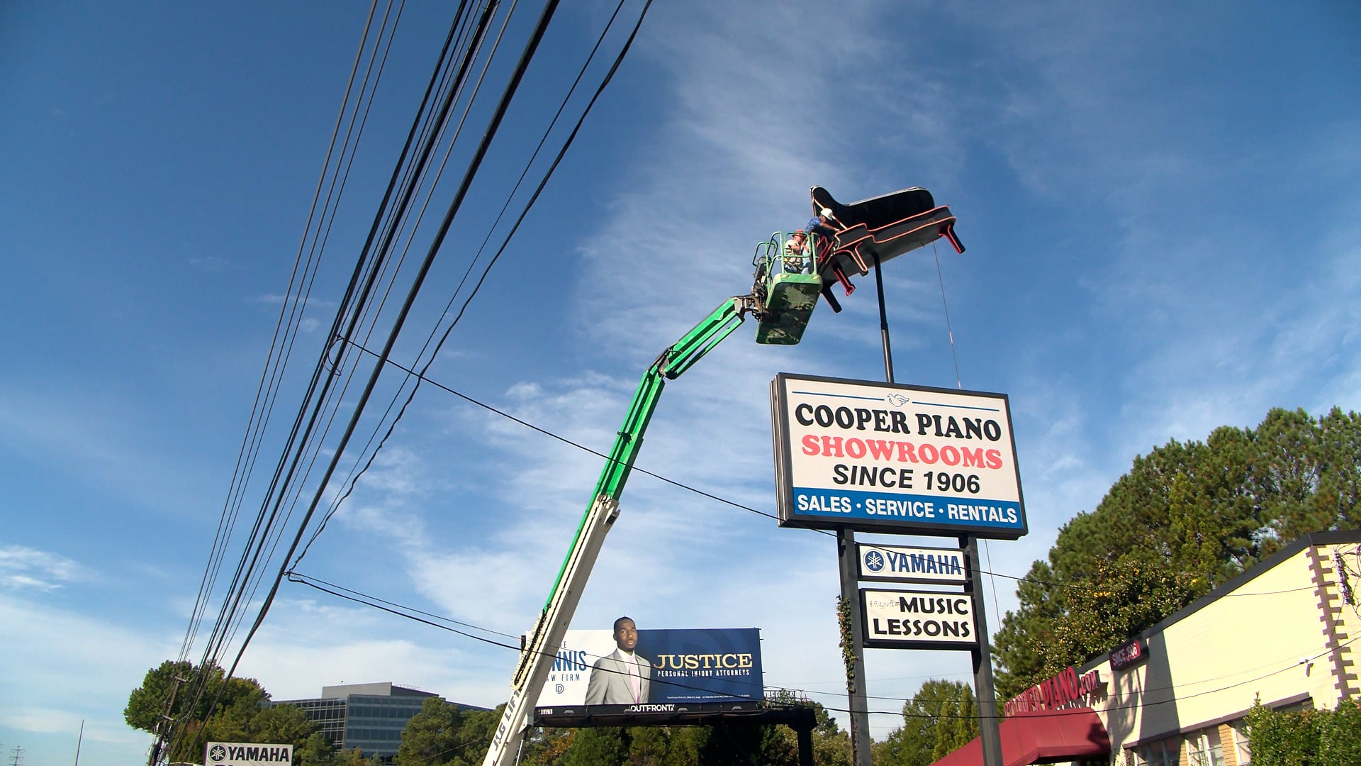 Iconic piano rising over I-85 taken down as family business moves