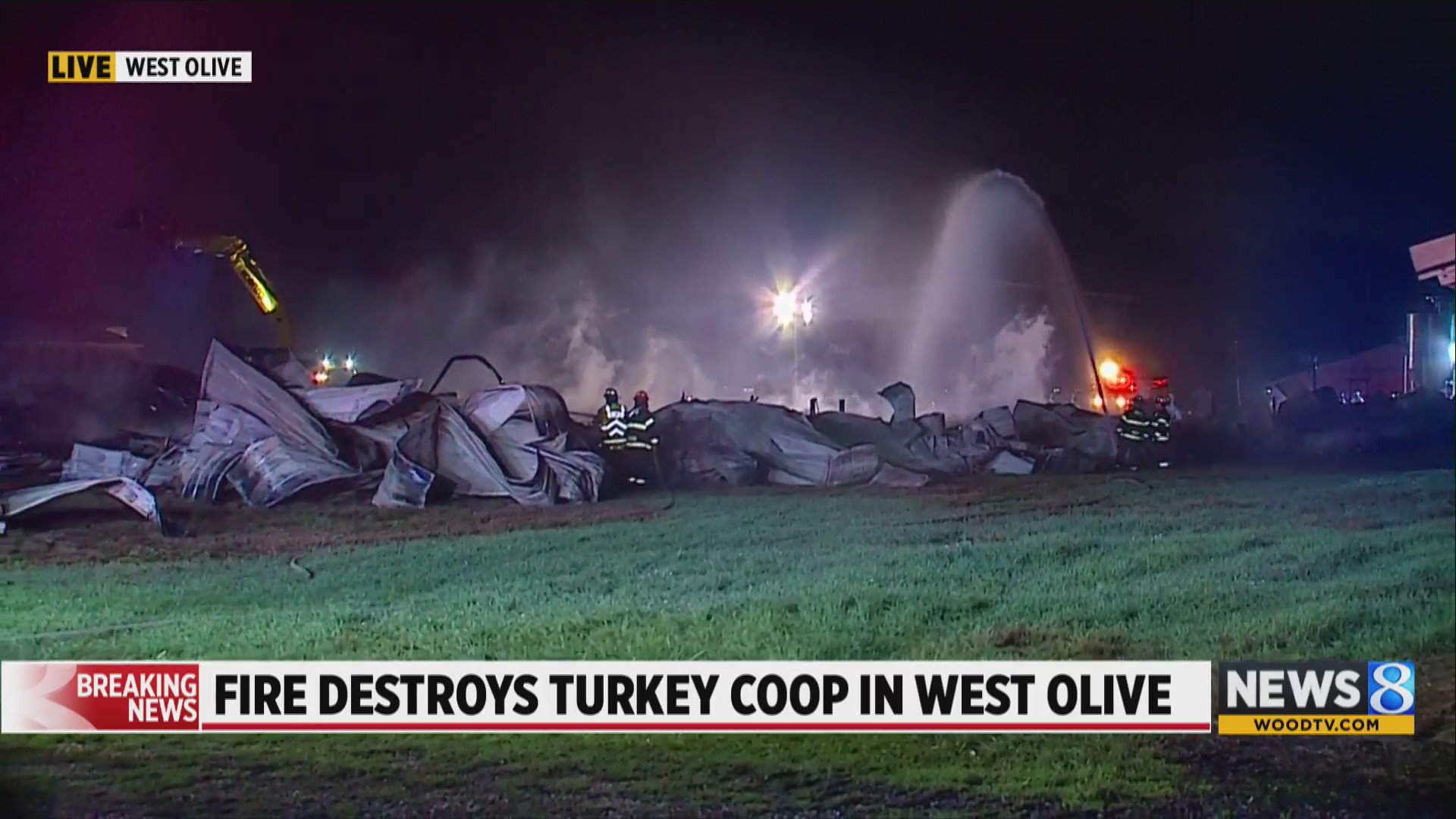 Firefighters work to put out flames at turkey coop