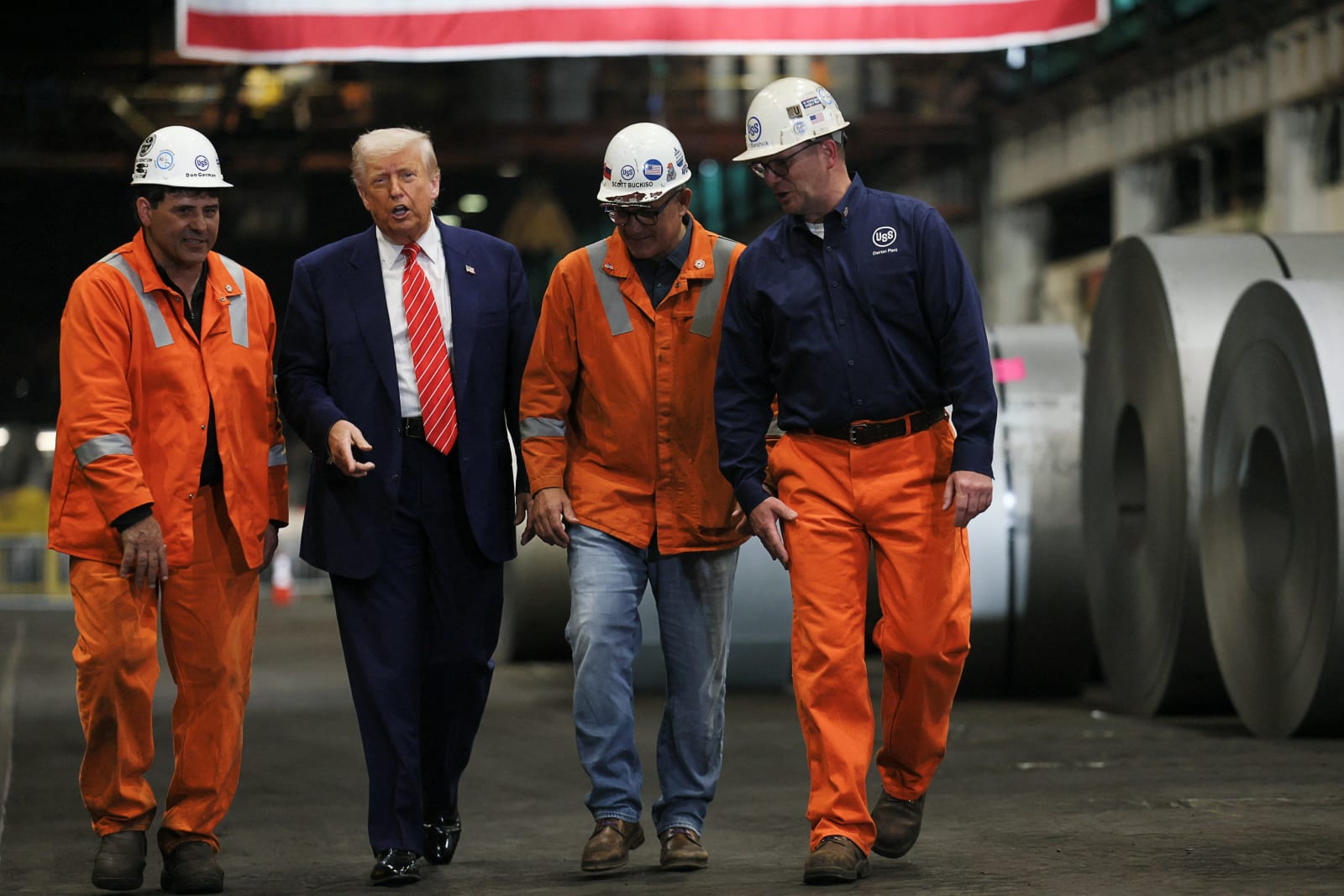 U.S. President Donald Trump walks with North American Flat-Rolled Segment Senior Vice President and Chief Manufacturing Officer Scott Buckiso, Plant manager of Irvin and Fairless Plant Donald German and Mon Valley Works United Steel Corporation Vice President Kurt Barshick, as he visits U.S. Steel Corporation–Irvin Works in West Mifflin, Pennsylvania, U.S., May 30, 2025. REUTERS/Leah Millis
