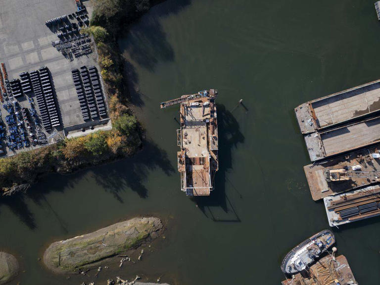 Derelict barge sat in Tacoma waterway for 2+ years. Cost to remove it ...