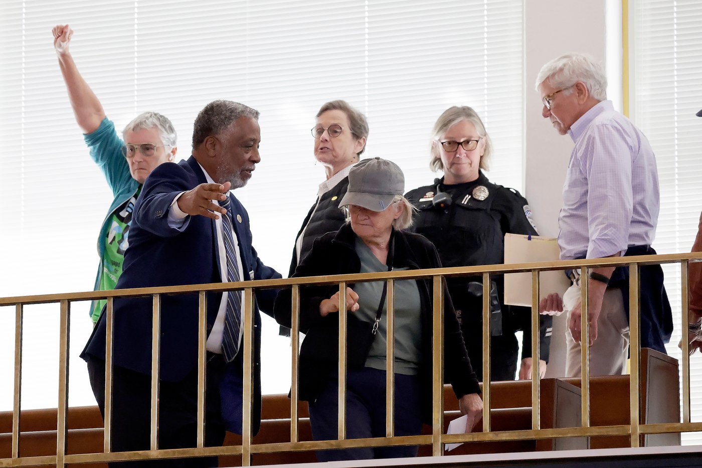 Security clears the gallery after an outburst during a redistricting bill debate at the Legislative Building, Wednesday, Oct. 22, 2025, in Raleigh, N.C. (AP Photo/Chris Seward)