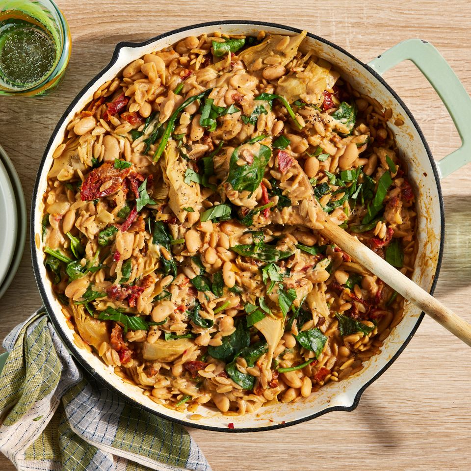 an image of the Creamy White Bean & Sun-Dried Tomato Orzo with Spinach & Artichokes