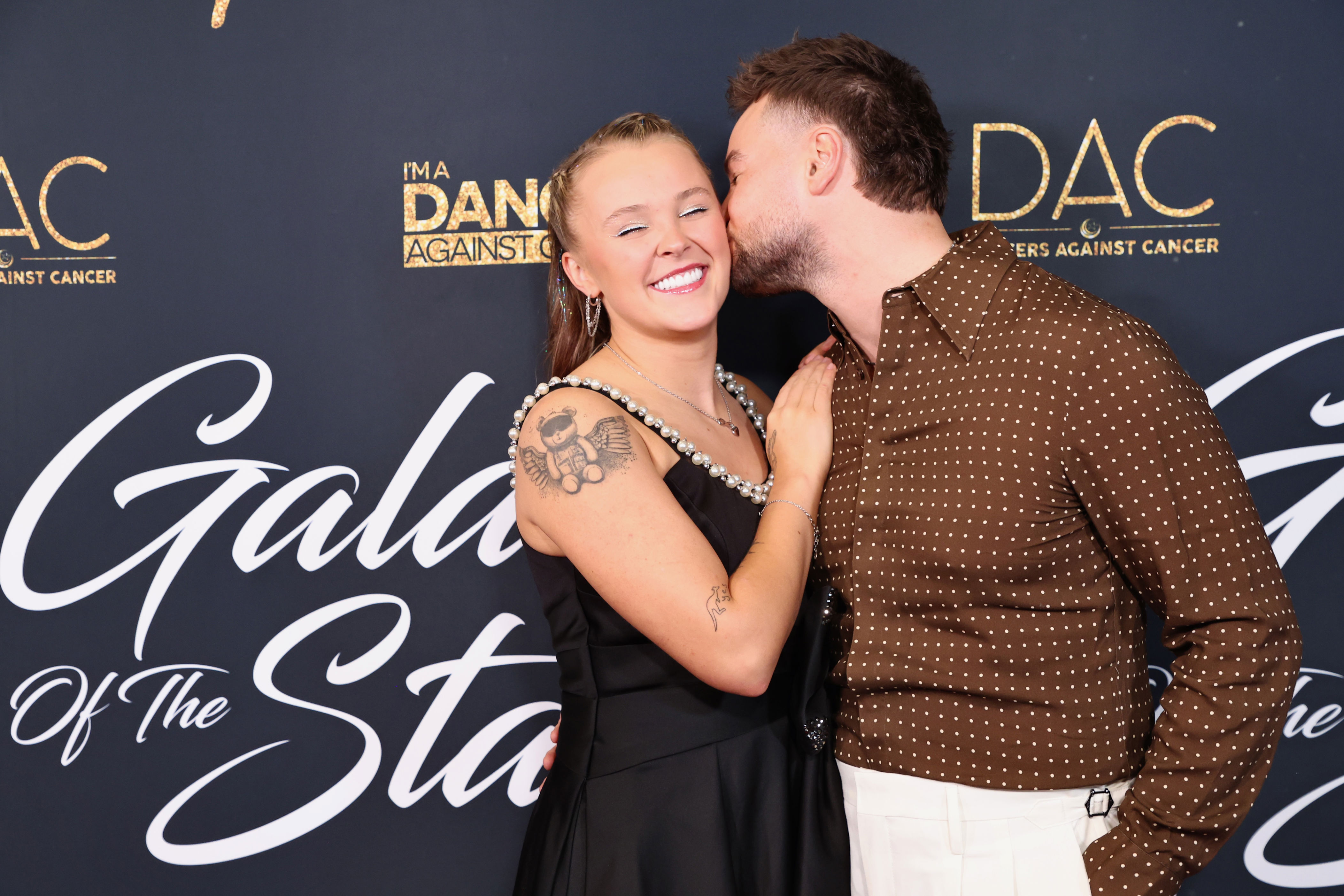 JoJo Siwa and Chris Hughes Pack on the PDA During Red Carpet Debut
