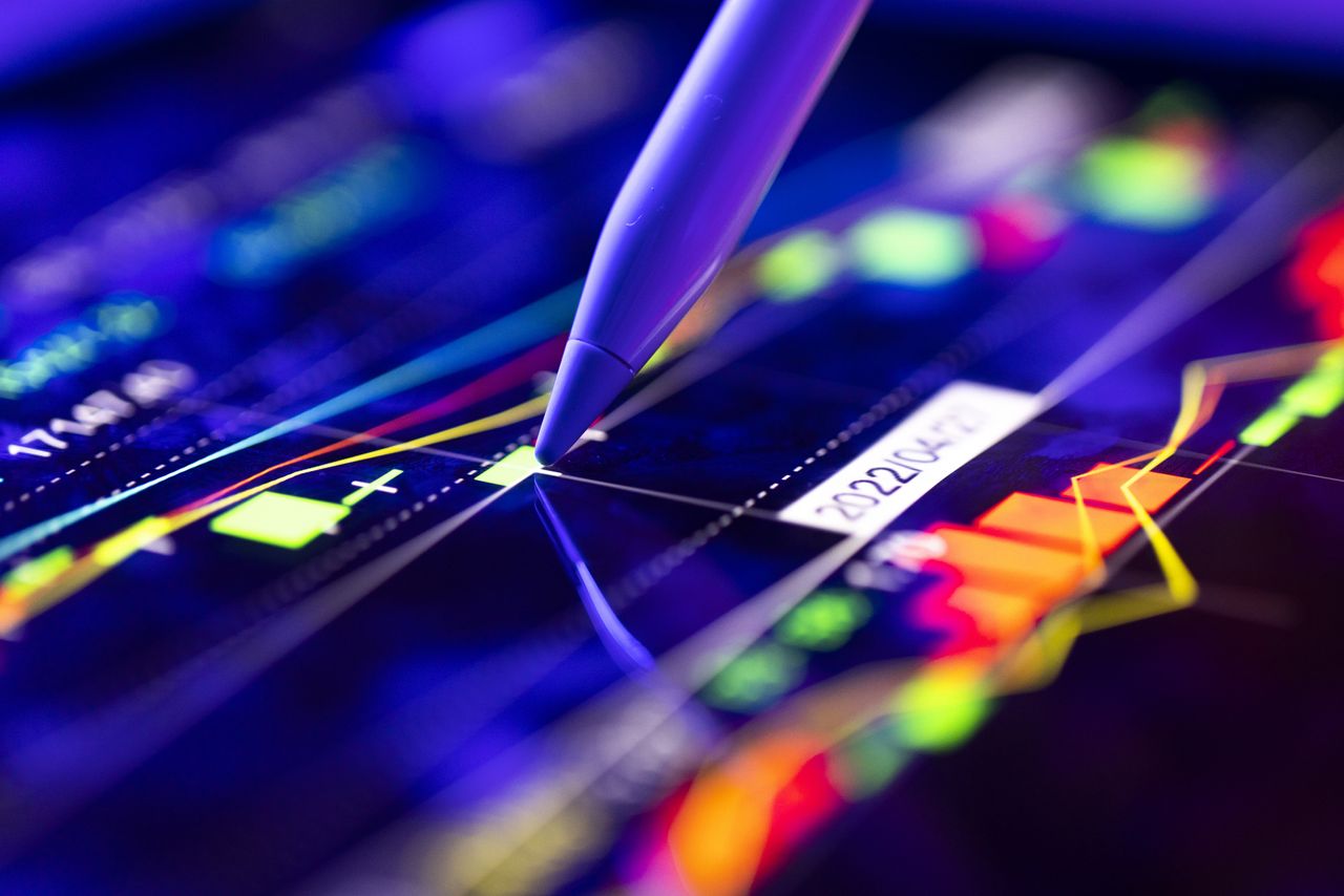 Coca-Cola and Boeing results boost the Dow, while chip stocks drag the Nasdaq