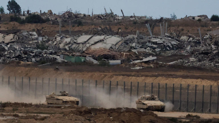 Israeli military vehicles manoeuvre, after U.S. President Donald Trump announced that Israel and Hamas agreed on the first phase of a Gaza ceasefire, on the Israeli side of the border with Gaza, October 9, 2025. REUTERS/Ammar Awad