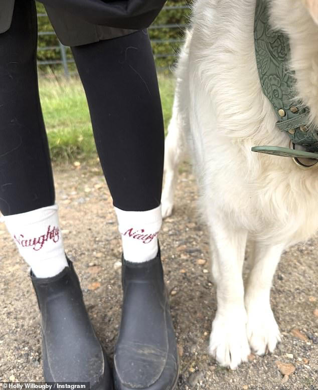 Holly Willoughby displayed her 'naughty' side as she shared a photo of her socks on Instagram on Friday after  she was criticised for cashing in on freebies