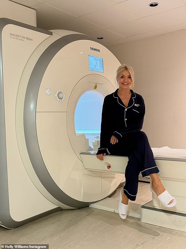 Holly pictured while having her MRI scan