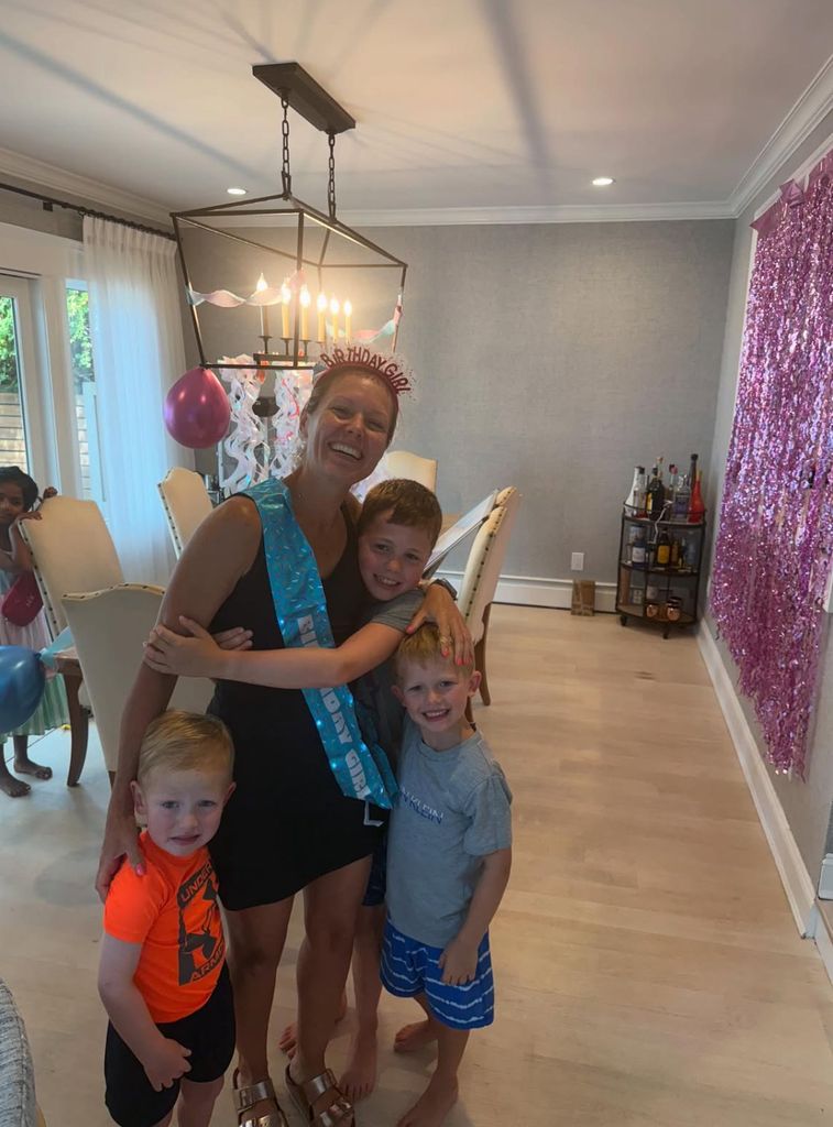 Dylan Dreyer with her three sons in her apartment