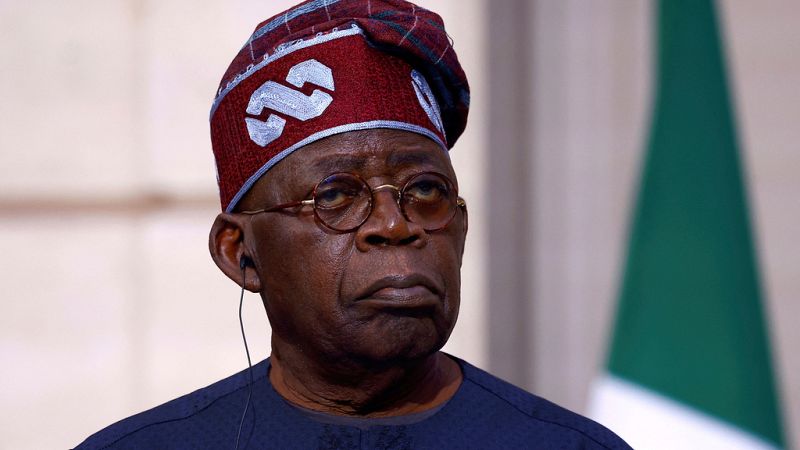 Nigerian President Bola Tinubu listens to French President Emmanuel Macron during a statement as part of his two-day state visit to France, Thursday, Nov. 28, 2024