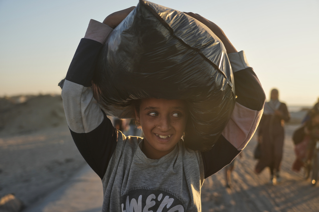 The Latest: Tens of thousands of Palestinians in Gaza return north as ...