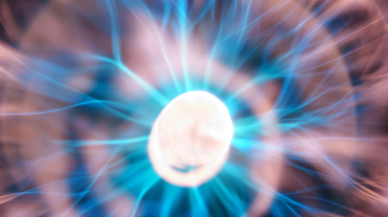 Plasma ball blue streaks of energy with grey discharges.