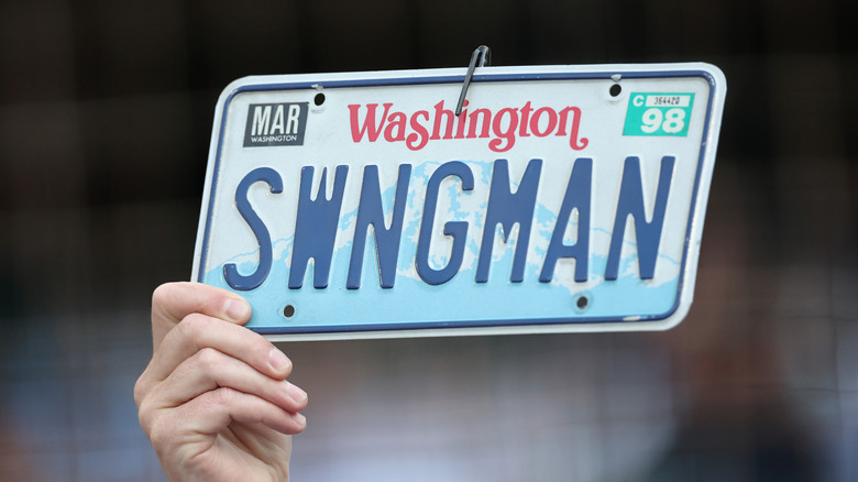 A Washington State license plate customized to read "SWNGMAN"