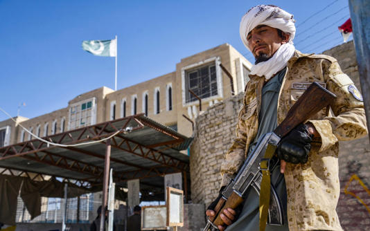 A Taliban fighter guards a border crossing in Kandahar province - AFP/Sanaullah Seiam