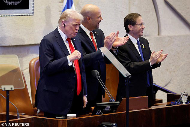 US President Donald Trump arrives to address the Knesset, with Amir Ohana, Speaker of the Israeli Knesset, and Israeli President Isaac Herzog on October 13, 2025, in Jerusalem