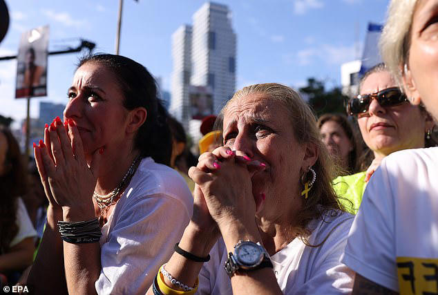 Israelis overcome with emotion celebrate the release of hostages held by Hamas in Hostage Square in Tel Aviv